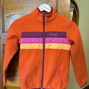 Girls ate a Cotopaxi Fleece Jacket with Purple and Pink Stripes
